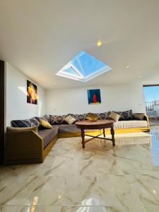 a living room with a couch and a table at بوابة الشمس 2 in Agadir