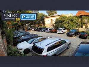 a row of cars parked in a parking lot at Uni88 ApartHotel in Bucharest +254 photos