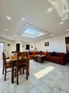 a living room with a couch and a table at The Sun Gate in Agadir
