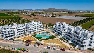 an aerial view of apartment buildings with a pool at Santa Rosalìa - Casa Elsalie in Torre-Pacheco