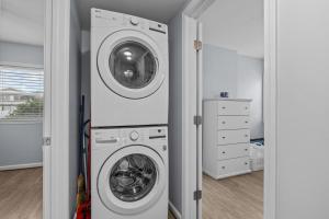 a laundry room with a washer and dryer at Boardwalk Shores D in Atlantic Beach