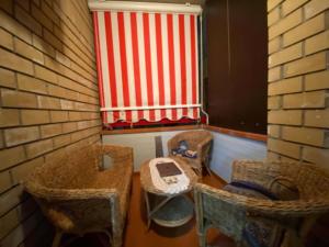 a bathroom with three wicker sinks and a window at Appartamento MiMoSa Scalea in Scalea