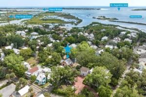 an aerial view of a small town with houses and the water at Mulberry Oasis in St. Augustine