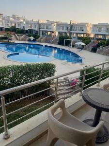 a view of a swimming pool from a balcony at Sky Star Villa 97 in Hurghada