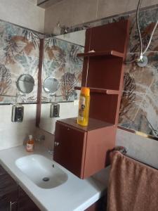 a bathroom with a sink with a bottle on it at Sky Star Villa 97 in Hurghada +16 photos