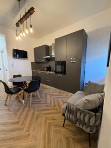 a living room with a table and a couch at Casa Amore Design - South Sardinia - in San Gavino Monreale