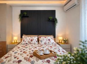 a bedroom with a bed with a tray on it at Le Rotte di Antonella in Lido di Ostia +20 photos