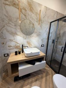 a bathroom with a sink and a shower at Casa Amore Design - South Sardinia - in San Gavino Monreale +24 photos