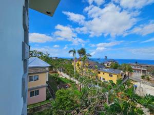 a view of the ocean from a building at Quiet Escape Unity Hall in Montego Bay