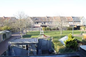 a view of a yard with houses and trees at Casa Seblina in Ostend