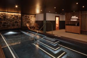 a swimming pool with stairs leading into a room at Lightwell Hotel & Spa in Hood River