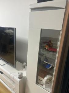 a refrigerator with its door open in a room at Bagneux cozy in Châtillon