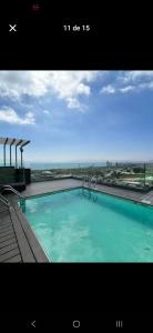 a large swimming pool on top of a building at Santa Rosa del Mar, Departamento in Coquimbo
