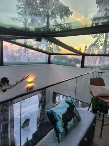 a view of a room with a window and a couch at Levi Secret Igloo Revontuli in Levi +83 photos