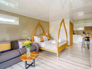 a living room with a bed and a couch at 1 Bed in Keswick oc-82476 in Bassenthwaite