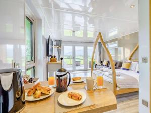 a room with a table with plates of food on it at 1 Bed in Keswick oc-82476 in Bassenthwaite