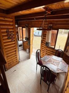 a dining room with a table and chairs at Cabaña in La Rioja