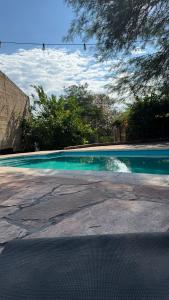 a swimming pool with a view of the sky at Cabaña in La Rioja