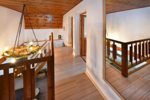 a staircase in a house with wooden ceilings at Chata Anna Tatranská Štrba in Štrba