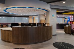 a lobby with a reception counter in a hospital at Tru By Hilton Miramar in Miramar +54 photos