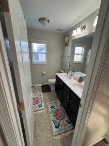 a bathroom with a sink and a toilet at The Bee & Bramble in Raeford
