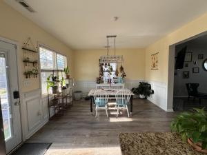 a dining room with a table and chairs at The Bee & Bramble in Raeford +5 photos