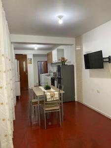 a kitchen and dining room with a table and chairs at Minidepartamento en Huaral in Huaral +4 photos