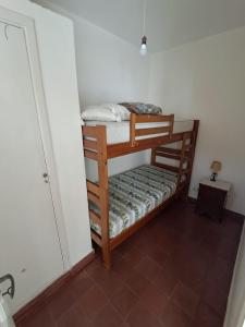 a small room with two bunk beds in it at Amplio dpto Miramar centro y playa in Miramar