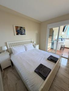 a bedroom with a large bed with two towels on it at Casa Ricardo Penthouse in Sitio de Calahonda +87 photos