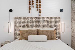 a bedroom with a bed with a large headboard at Apollo Bay Gone Surfin in Apollo Bay