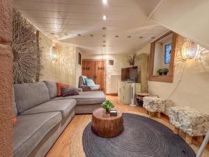 a living room with a couch and a table at Neef in Neef