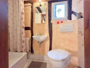 a bathroom with a toilet and a sink and a tub at Neef in Neef +27 photos