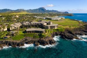 an aerial view of a house on a cliff at MA-1205 - Ocean Views AC in Koloa