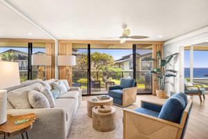 a living room with a couch and a table at MA-1205 - Ocean Views AC in Koloa