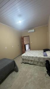 a bedroom with two beds and a window at Casa pôr do Sol in Aracaju +18 photos
