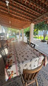 a table with a table cloth on it on a patio at Casa pôr do Sol in Aracaju