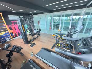 an overhead view of a gym with a bike and weights at Flat Premium no Centro de Porto de Galinhas - Próximo as piscinas naturais in Porto De Galinhas
