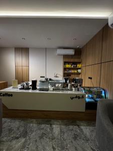 a kitchen with a sink and a counter at فندق وفود فرع القريات in Al Qurayyat