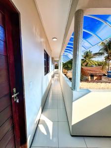 an open door to the balcony of a house at Pousada do Horto in Juazeiro do Norte