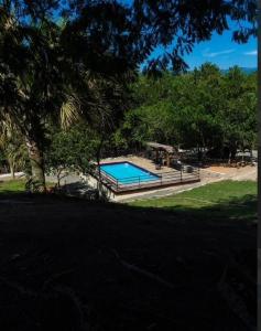 a swimming pool in the middle of a yard at Villa Gregorio mountain top in Bonao