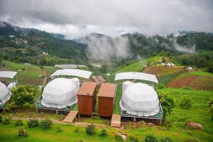 a group of tents on top of a hill at MonLanna Homesty in Ban Thung Pa Haeo