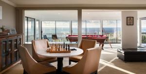 a living room with a table and a pool table at Stunning View Estate with Pool & Game Room in La Mesa