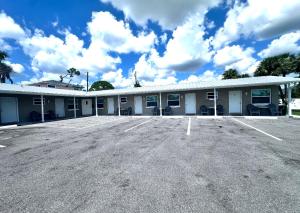 an empty parking lot in front of a building at Lemon Bay Motel in Englewood