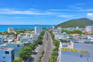 an aerial view of a city with the ocean at Selima Hotel in Quy Nhon