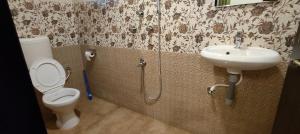 a bathroom with a toilet and a sink at Little Nest in Mandrem +66 photos