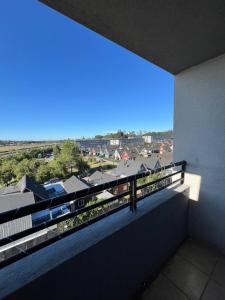 a balcony with a view of a city at Vista a los volcanes in Puerto Montt