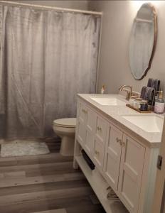a bathroom with a sink and a toilet and a shower at Cozy condo at Attitash Mountain Village in Bartlett +8 photos
