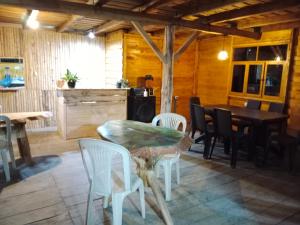 a dining room with a table and chairs at Cabañas Sumak Kawsay in Colón