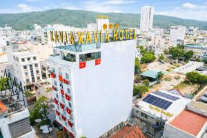 an aerial view of a building with a sign on it at Xavia Hotel Quy Nhơn in Quy Nhon +61 photos