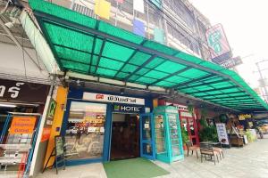 a building with awning over the entrance to a store at P1 House Phitsanulok in Phitsanulok